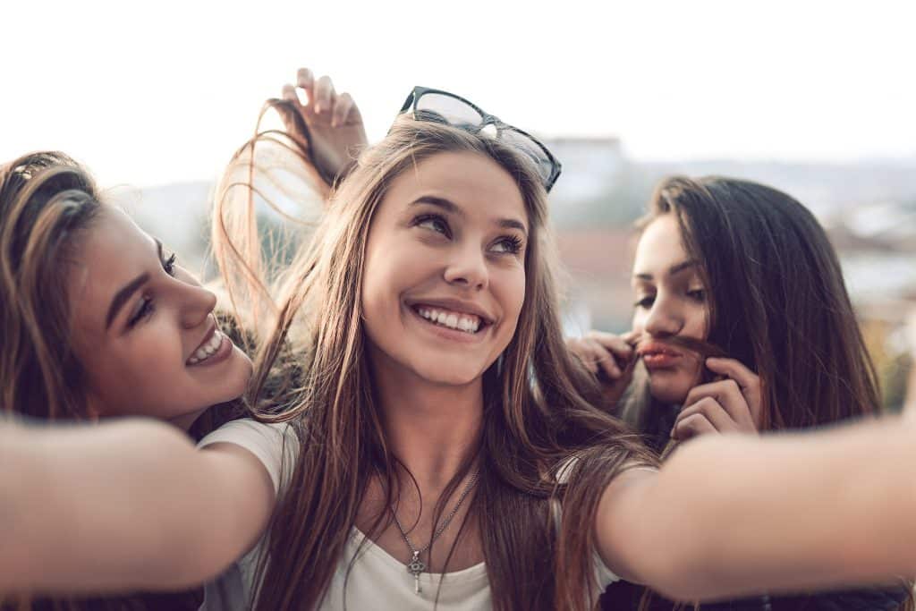 Seattle Digital Marketing | Female Highschool Taking Funny Selfie