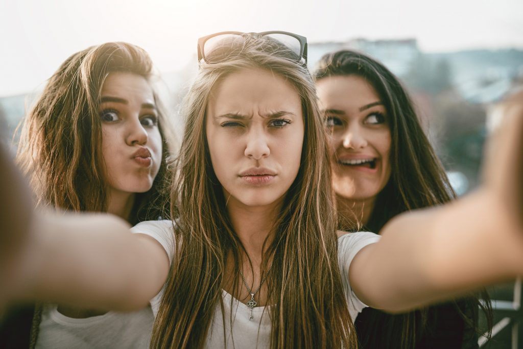 Seattle Digital Marketing | Three Crazy Female Friends Making Funny Facial Expressions On Selfie
